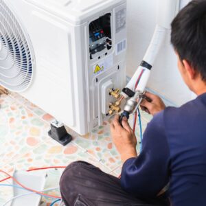 hvac tech working on ac