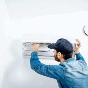 man fixing air conditioner