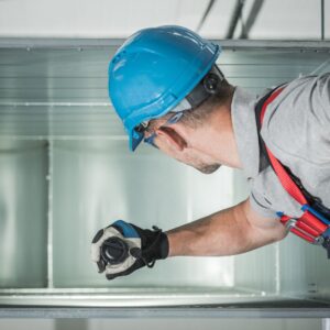 hvac contractor with flashlight