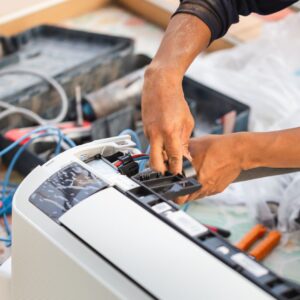hvac technician working on heater