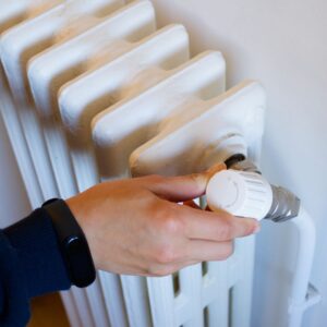 person turning on heater