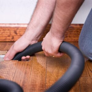vacuuming an air vent