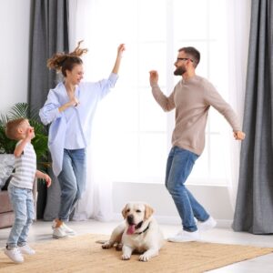 family dancing in living room