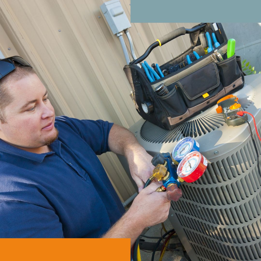 man fixing AC unit