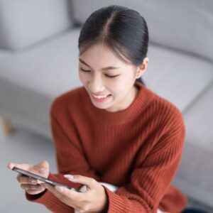 img of a eoman looking at a phone